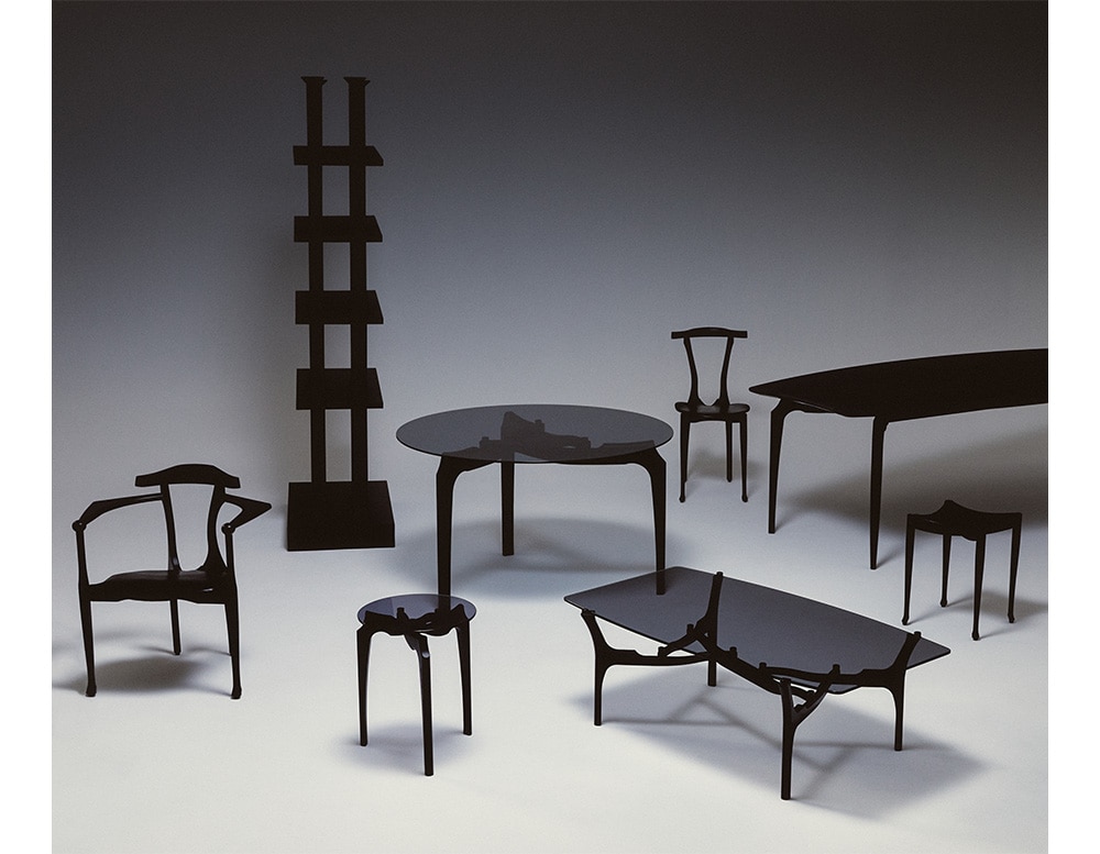 line of furniture made with black wood and black or transparent glass in different sizes and designs