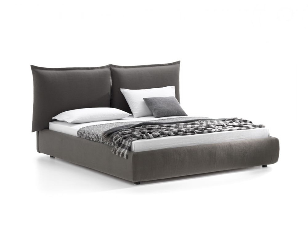 bed with headboard divided into two large cushions made of fabric and wood in a dark gray tone in a white background