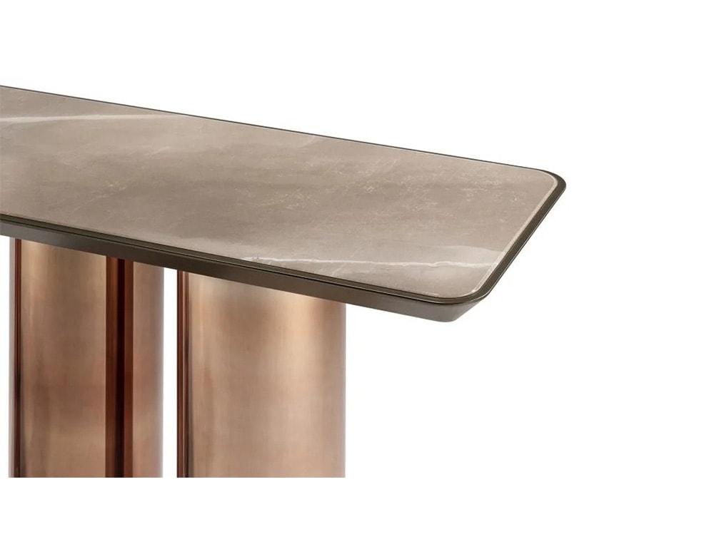 table made of brass with a thin top for its 3 axes on a white background