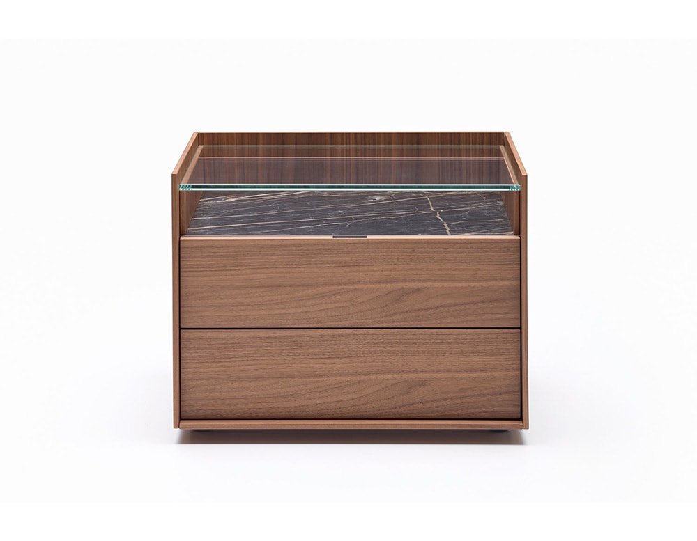 vanity table with pressure drawers made of wood in different shades of coffee and a thick transparent glass top