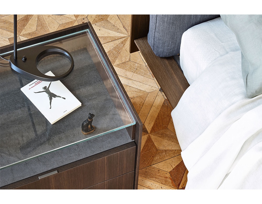 nightstand made of dark wood transparent glass top