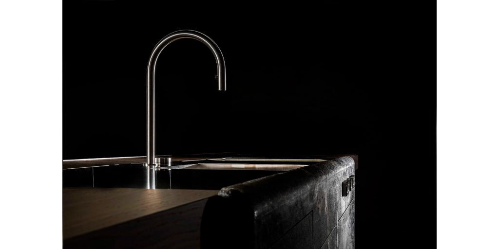 counter with sink made of metal, wood and stone