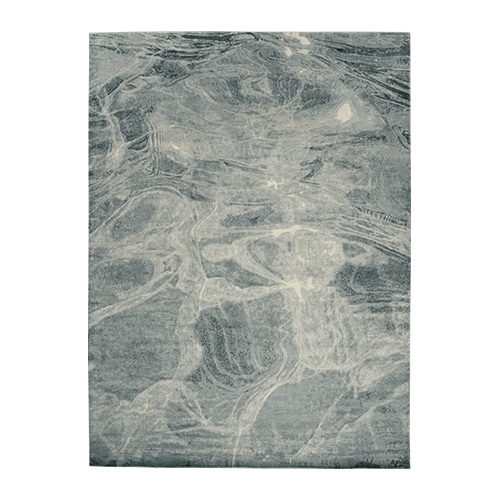 rug made of fabric with finishes simulating sea waves in a bluish tone in different intensities