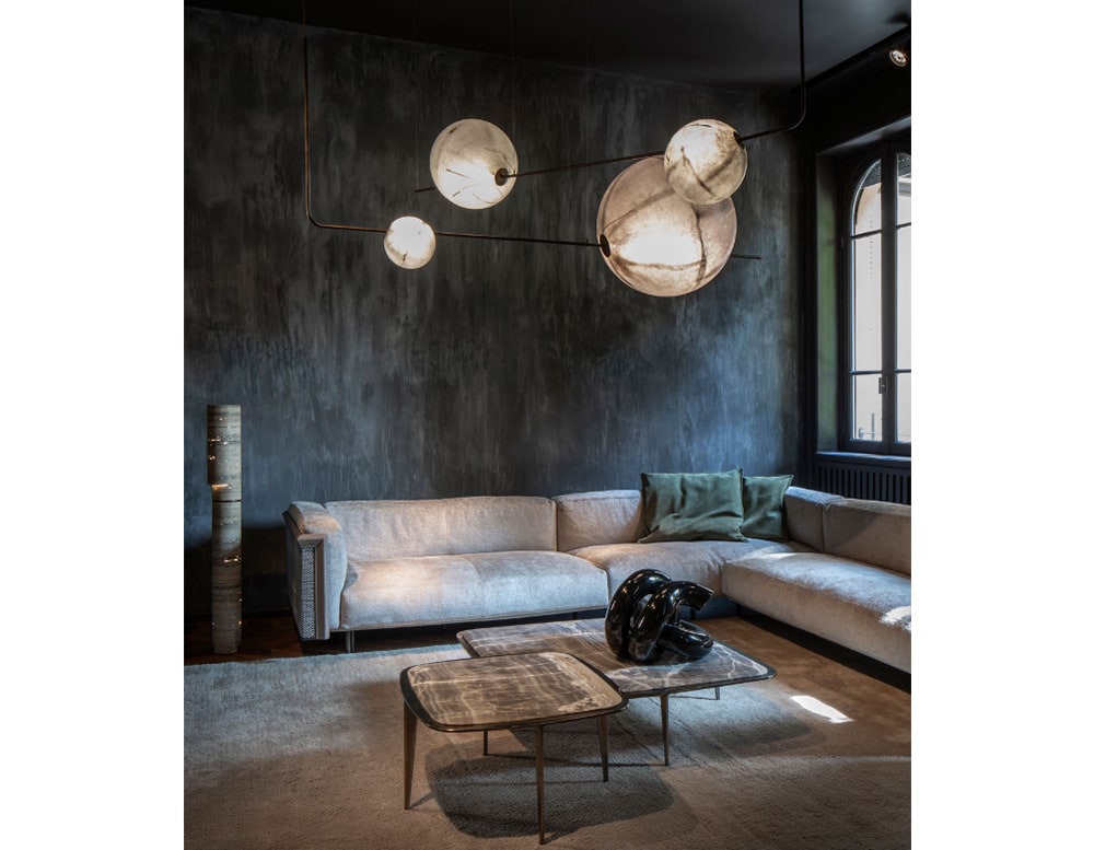 sphere shaped lamps made of fiberglass, brass and gold metal in a room