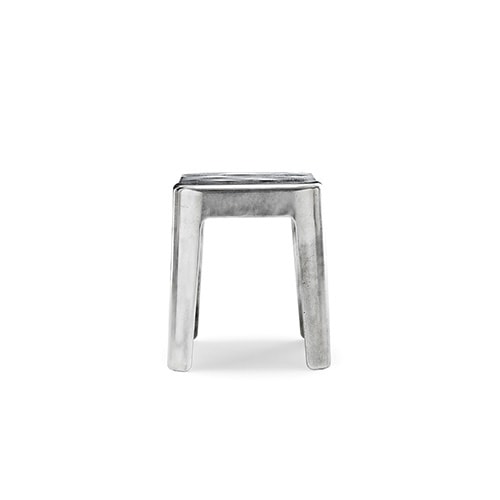 centerpiece made of aluminum and bronze with a silver tone on a white background.