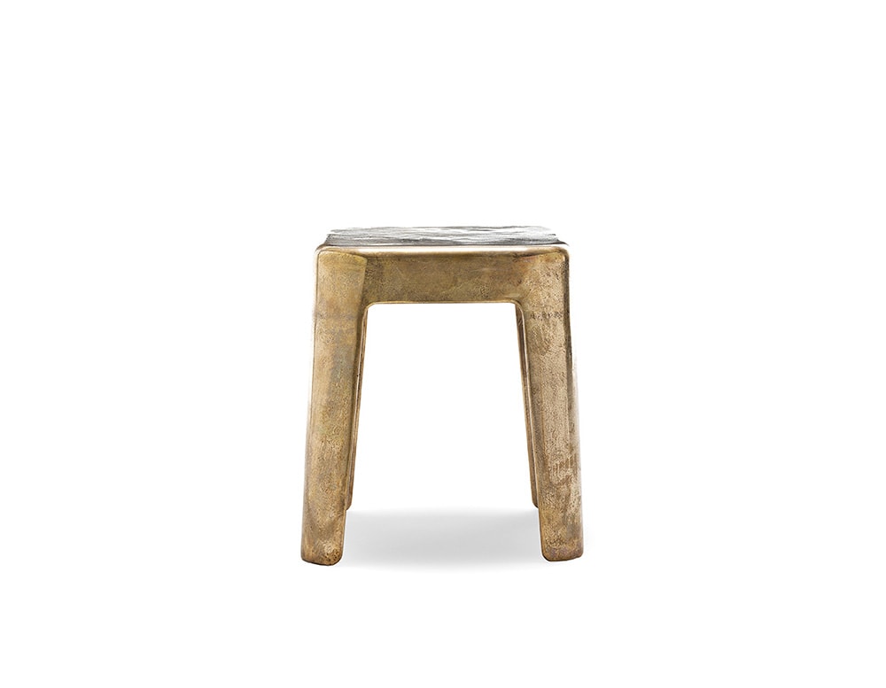 centerpiece made of aluminum and bronze with a golden tone on a white background