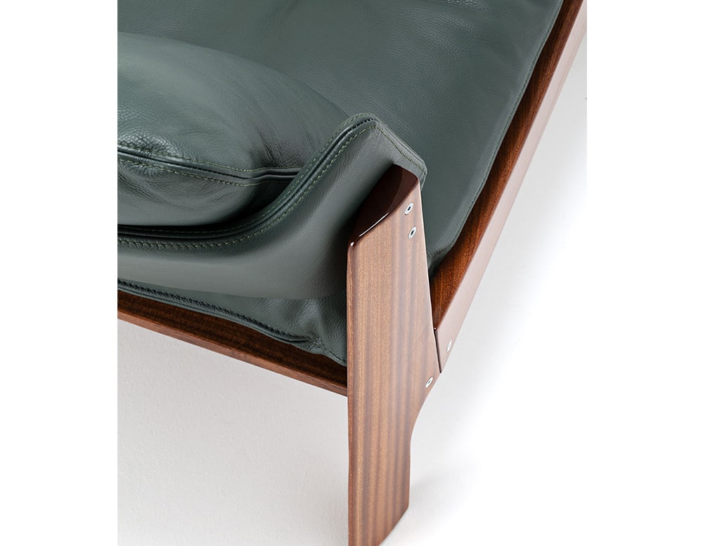 removable armchair made with brown wood and green leather