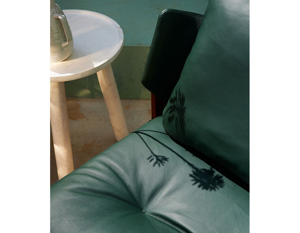 removable chairs upholstered with dark green leather on their padding