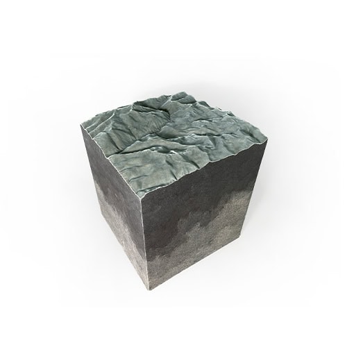 The Horizons Pouf showcases a cube form with a unique textured top that resembles sculpted landscapes. Its layered tones and irregular surface make it a striking accessory or seat, adding depth and artistry to any interior.