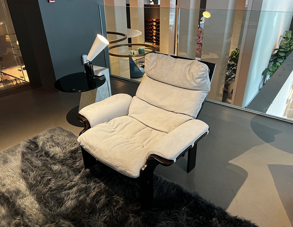 Dark brown wooden armchair with an iced gray suede finish