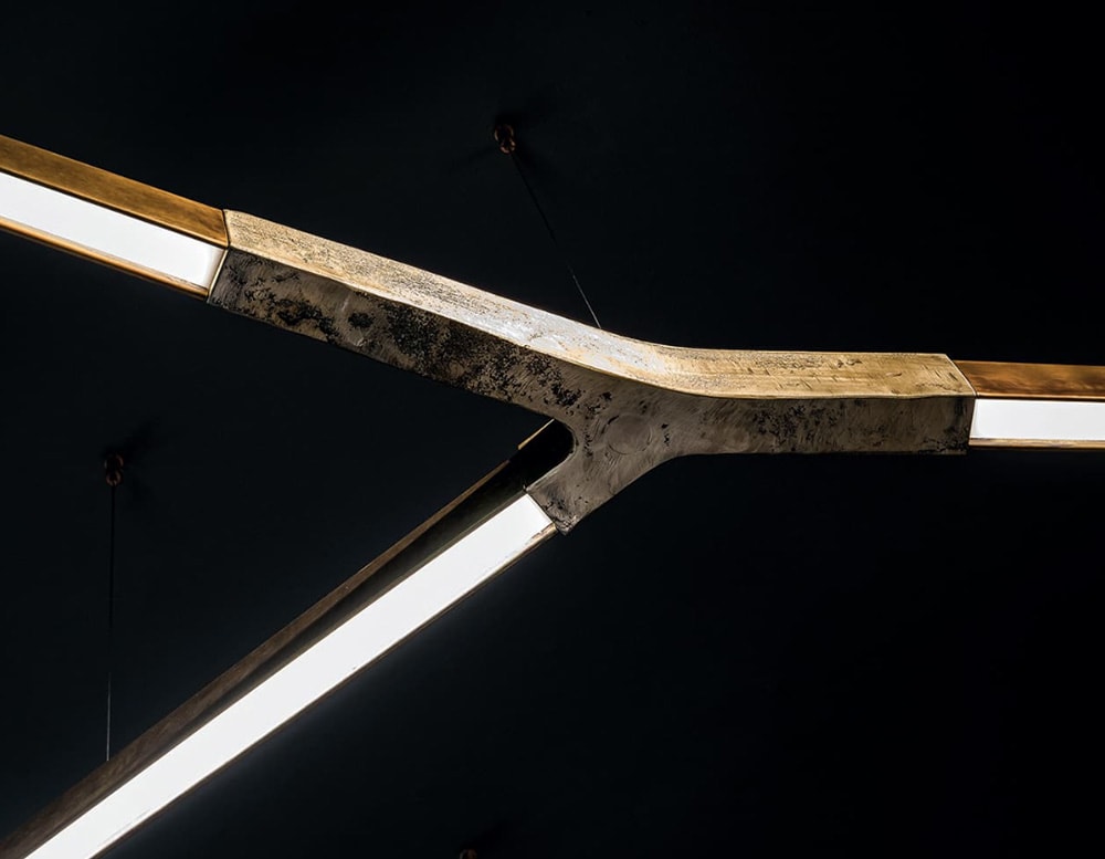 Center of a bronce color ceiling lighting In Burnished Brass with Sand Casting Brass finish