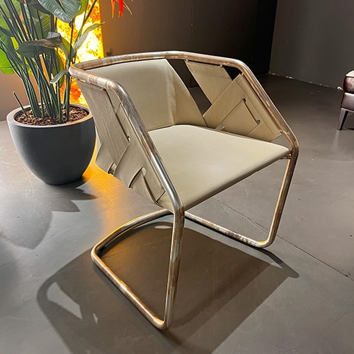 chair made from brown leather and with metal bases