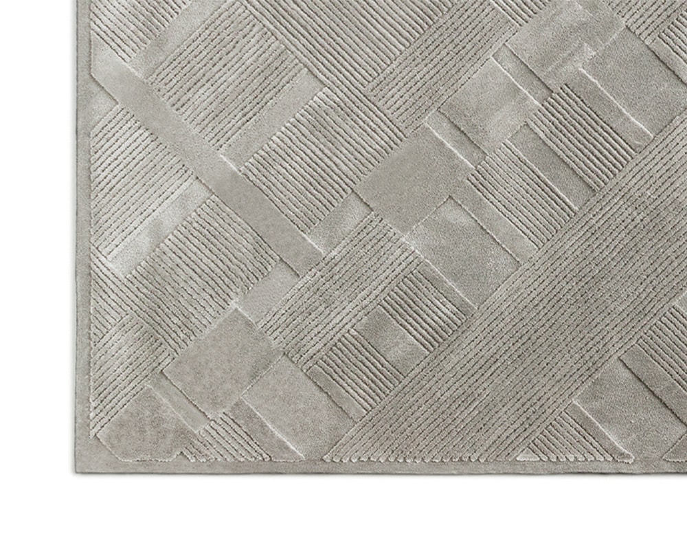 woven rug in different levels in its finish, in an ice color tone in a white background