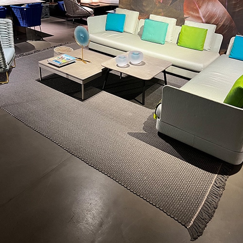 rug made on manual looms from synthetic fibers in a gray tone