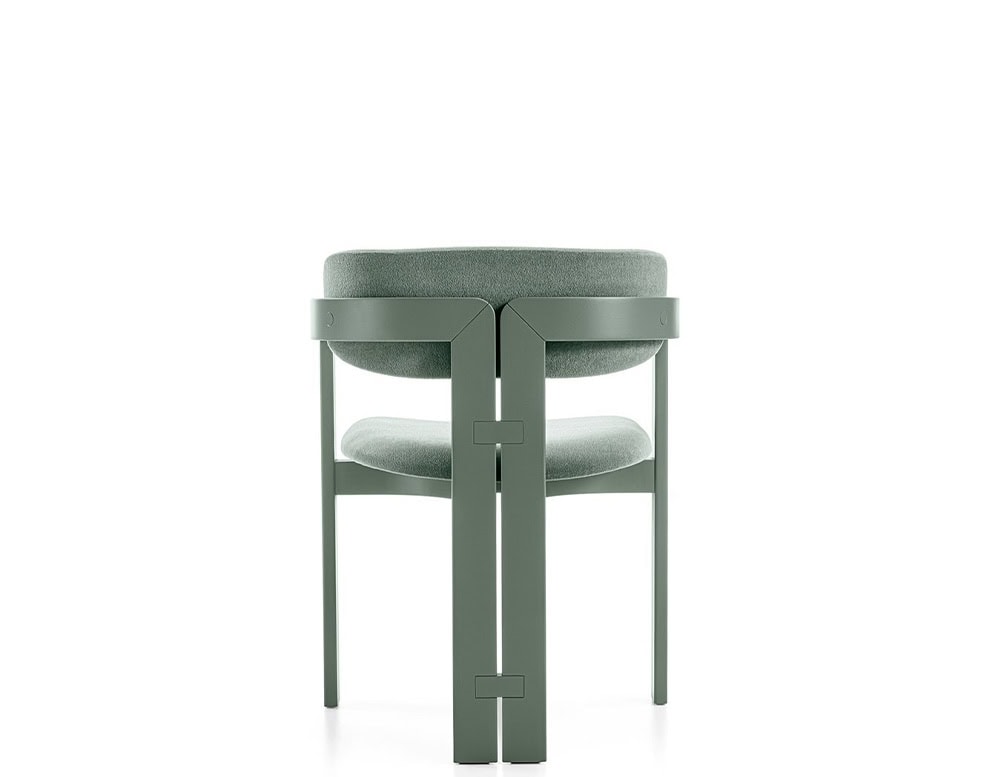 Curved ash wood chair upholstered in green leather on a white background.