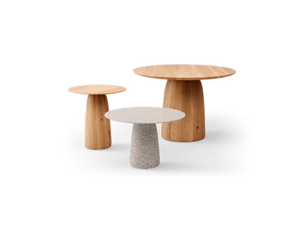 auxiliary tables of different sizes made of stone or light brown wood on a white background
