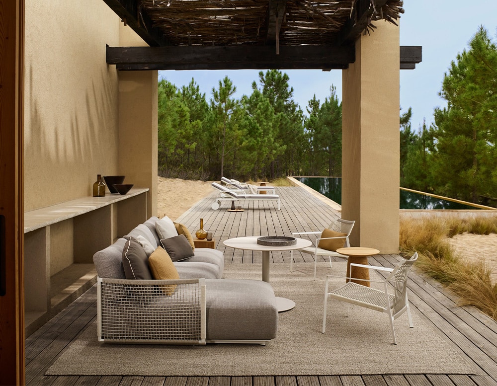 armchair made of gray steel and gray fabric with cushions of two different shades and sizes
