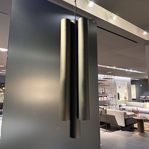 Sleek cylindrical pendant in a matte metallic finish providing modern elegance and soft ambient lighting for contemporary spaces.