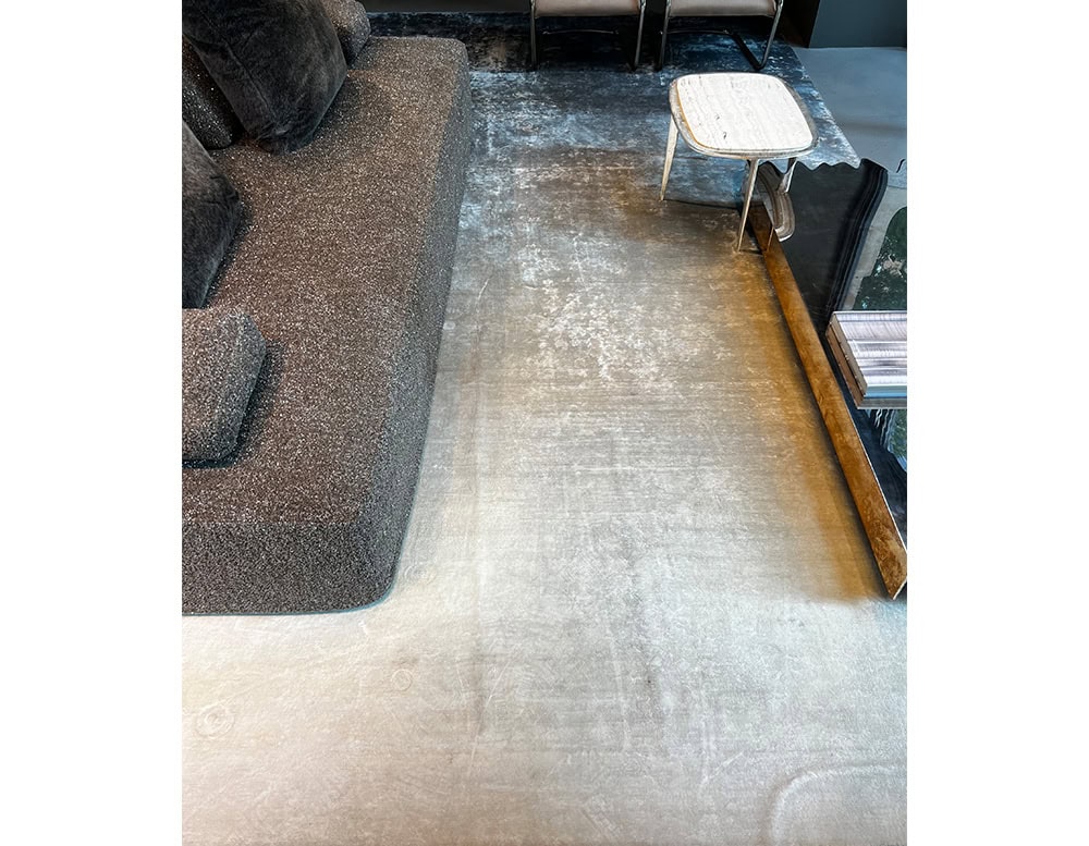 A custom Bambu Silk Rug with a smooth gradient texture in neutral shades enhancing the elegance of a contemporary living space