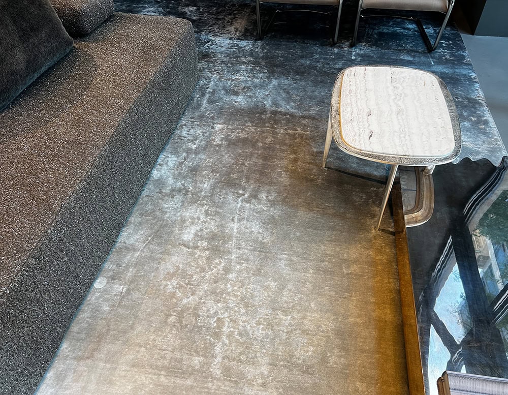A custom Bambu Silk Rug with a subtle gradient design in soft neutral hues adding warmth and sophistication to a modern living area