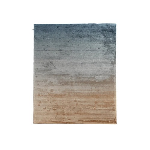 DeViant Rug blends moody navy and stone gray with a warm sandy base, creating a peaceful visual gradient that evokes coastal tranquility in contemporary spaces.