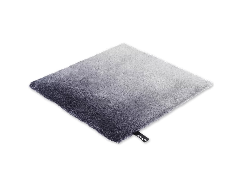DeViant Rug presents a smooth gradient of cool tones, transitioning from icy silver to deep indigo. This elegant contrast creates a serene and modern visual effect.