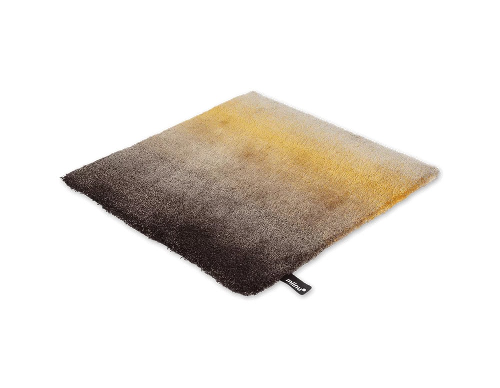 DeViant Rug features a smooth gradient blending rich espresso brown with warm amber and golden hues. This sophisticated palette brings a grounded yet radiant presence to interior spaces.