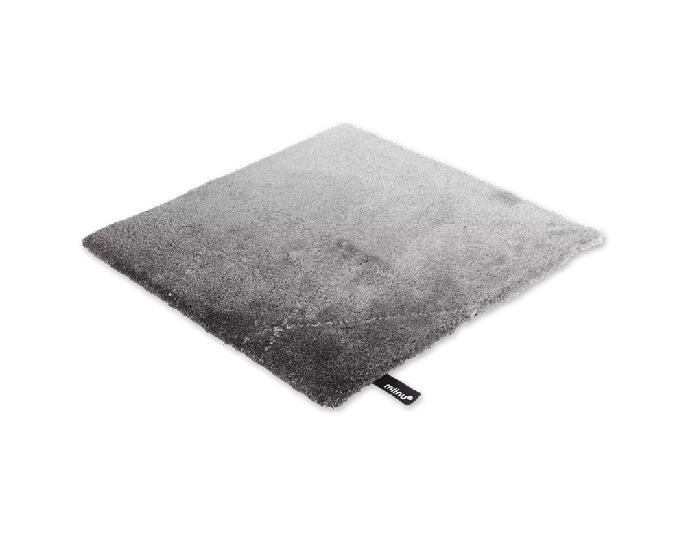 DeViant Rug showcases a refined gradient of grays, moving gently from pale silver into a rich charcoal tone. Its soft texture and minimalist palette make it a versatile piece for both contemporary and classic interiors.