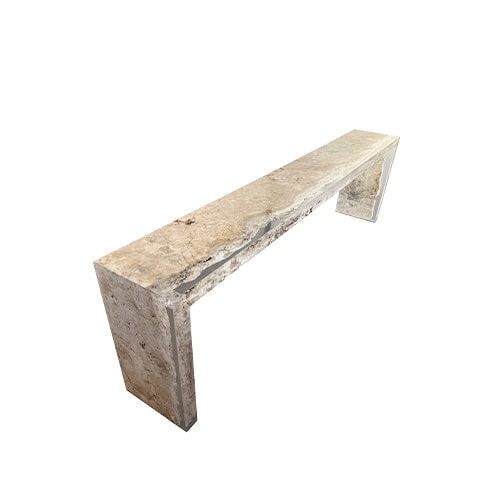 Stone console with raw textured edges and polished surfaces that highlight natural patterns. The clean rectangular form contrasts rugged detail with refined finish, making it a sculptural accent piece.
