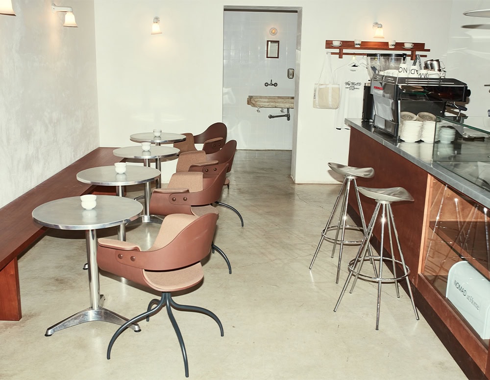 Showtime Bar Chairs in a muted clay brown finish blend seamlessly into this warm-toned cafe. The design’s gentle curves and split-back structure provide both comfort and sculptural elegance.