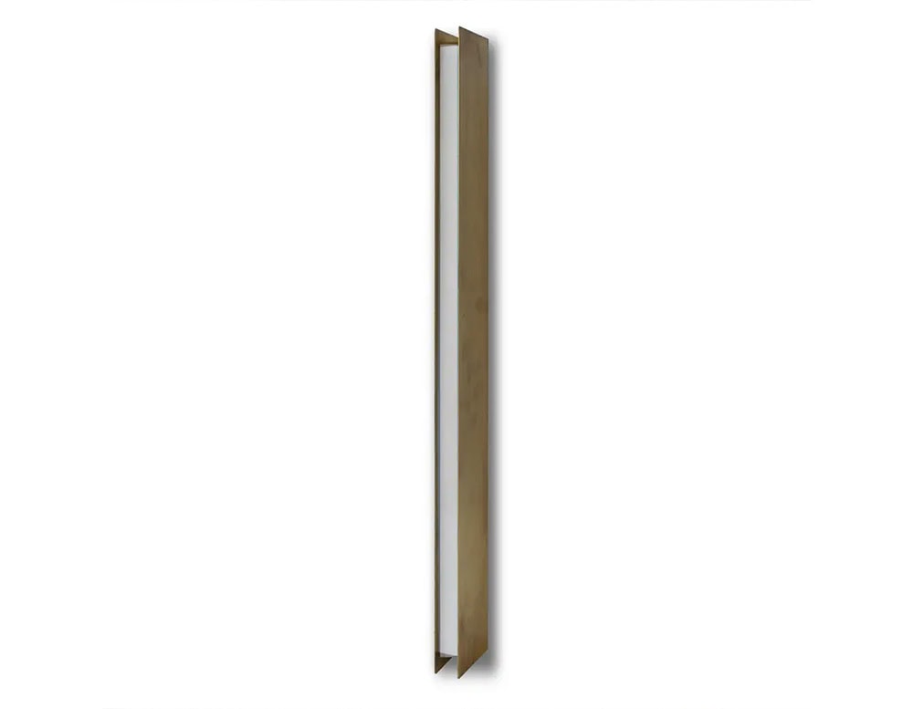 Bax Blade Wall Light presents a clean, geometric silhouette in brushed metal with an inset white panel that suggests hidden illumination. The light is set against a white backdrop, emphasizing its slim form and architectural presence.