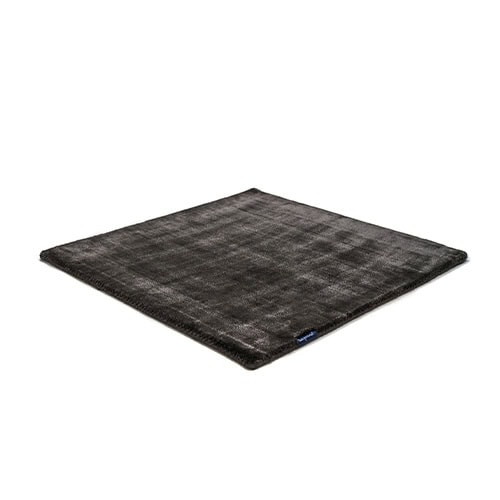 Pearl Rug in Panther features a deep, rich tone and a refined sheen that enhances its luxurious appeal. Its smooth, velvety texture and minimalist design make it a versatile and elegant choice for modern interiors.