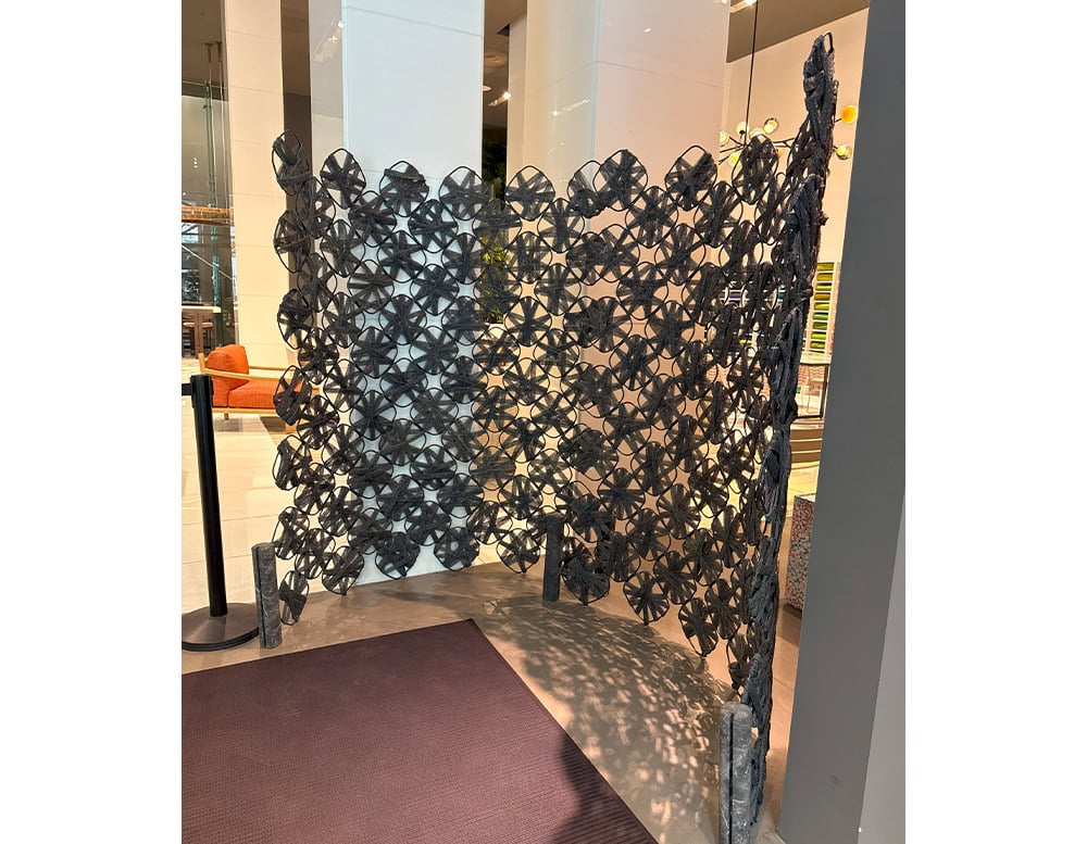 PL Rota Screen Blue showcases a striking petal formation with intricate, handwoven texture. This modular structure casts layered shadows, serving as both room divider and sculptural statement in contemporary interiors.