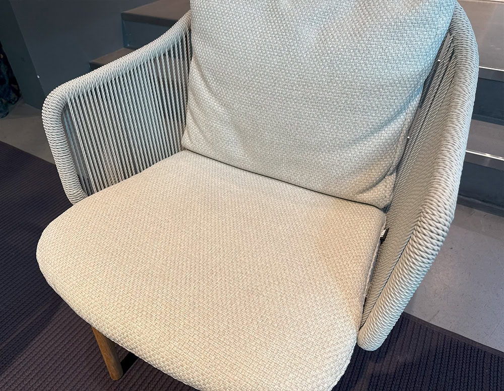 The Tri Senja Outdoor Dining Chair features tightly woven rope and textured cushions that embrace comfort and durability. With its inviting tactile feel and clean silhouette, this chair blends softness and structure in refined outdoor design.