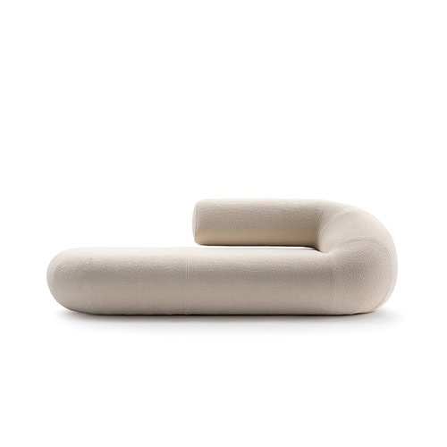 A single module of the Evolis Sofa featuring rounded contours and a minimal silhouette. The upholstery has a light, neutral tone with a subtly textured surface.